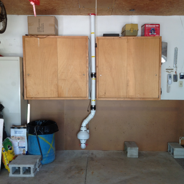 Custom radon mitigation system through attached garage